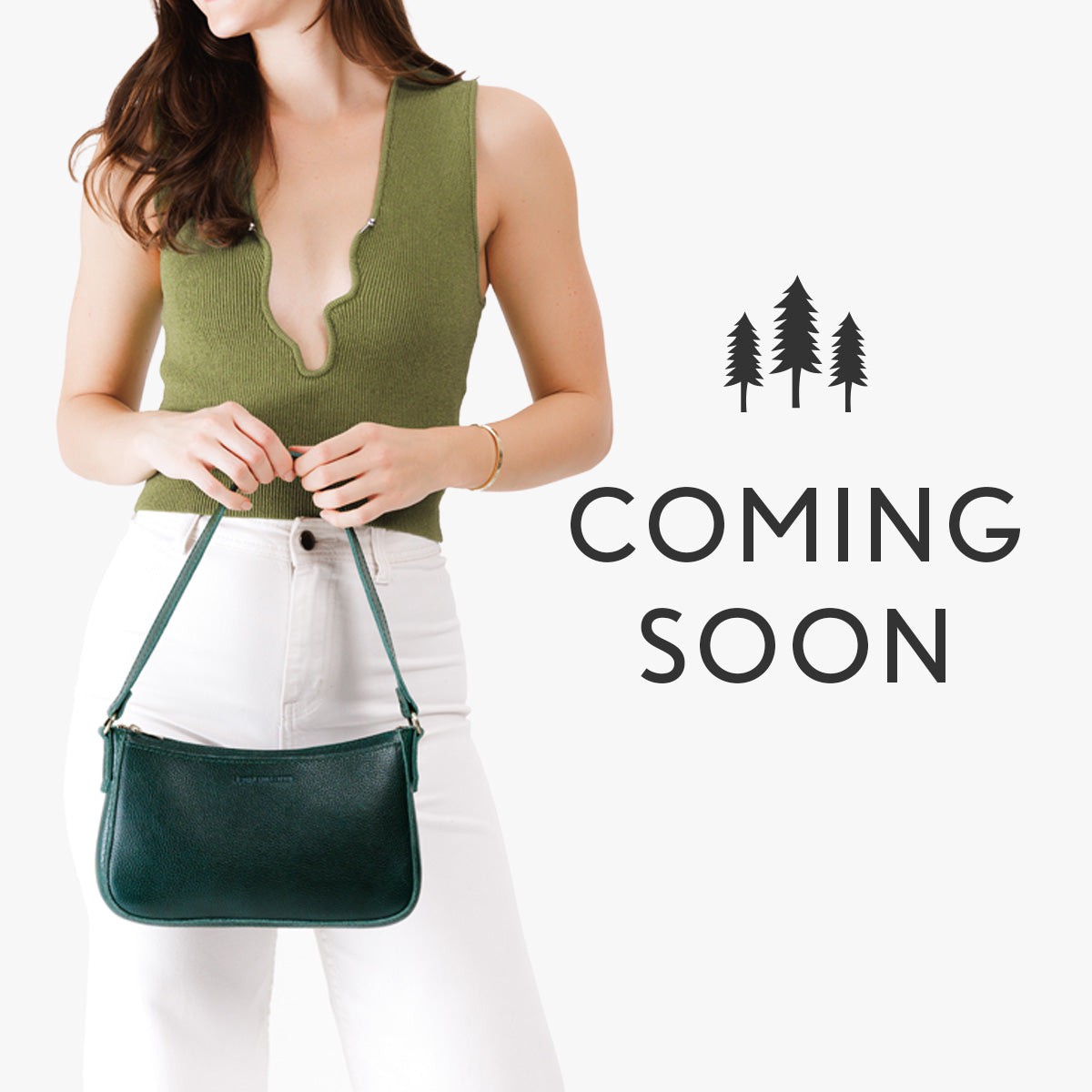 A model holding a purse. Text says coming soon.