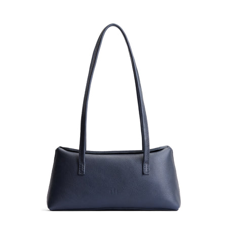 Night Owl | Leather bowler bag with magnetic closure against a white background