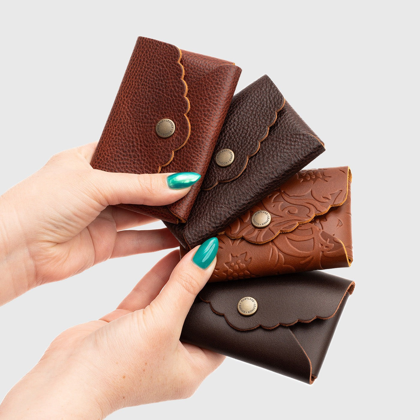 All Variants | Model holding four Daisy Plus Wallets