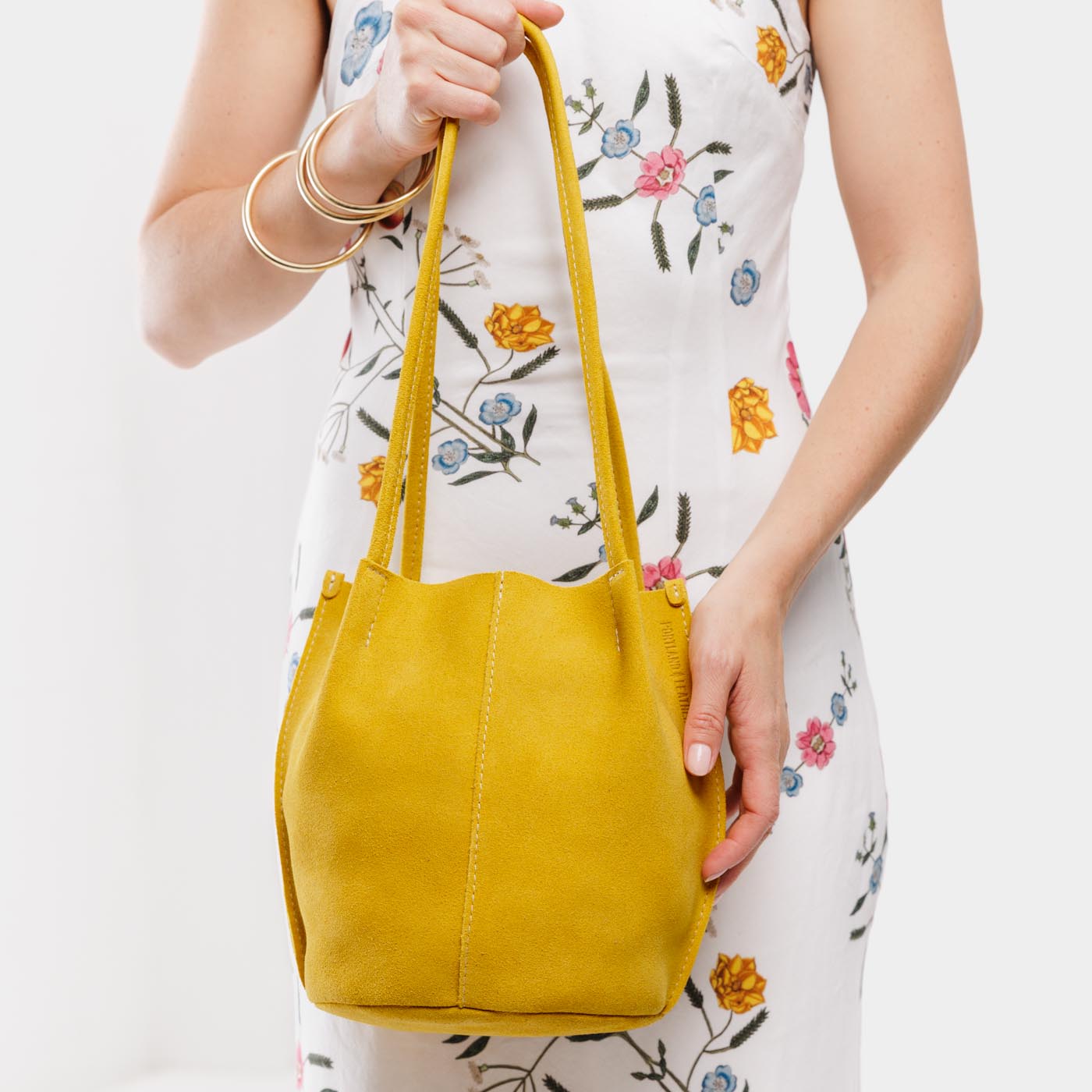 Hello Yellow*Classic | Model wearing petite bucket shaped tote bag with matching leather handles