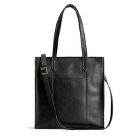 Pebbled--black*North/South | Structured large tote bag with overlapping panels and crossbody strap