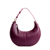 Lollipop*Classic | Crescent shaped shoulder bag with zipper closure and adjustable strap