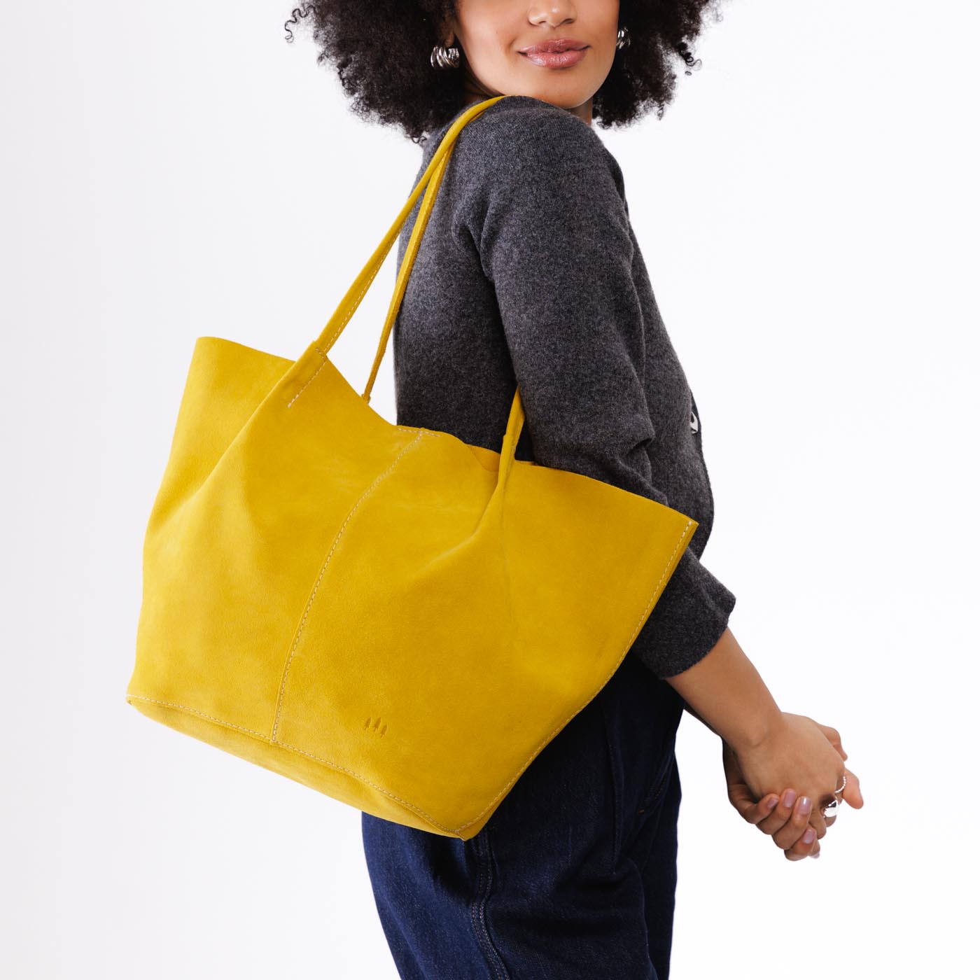 Hello Yellow*Oversized | Model holding extra wide bucket shaped tote bag with matching leather handles