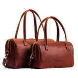 Nutmeg | Two sizes of mini duffle shaped handbag with crossbody strap