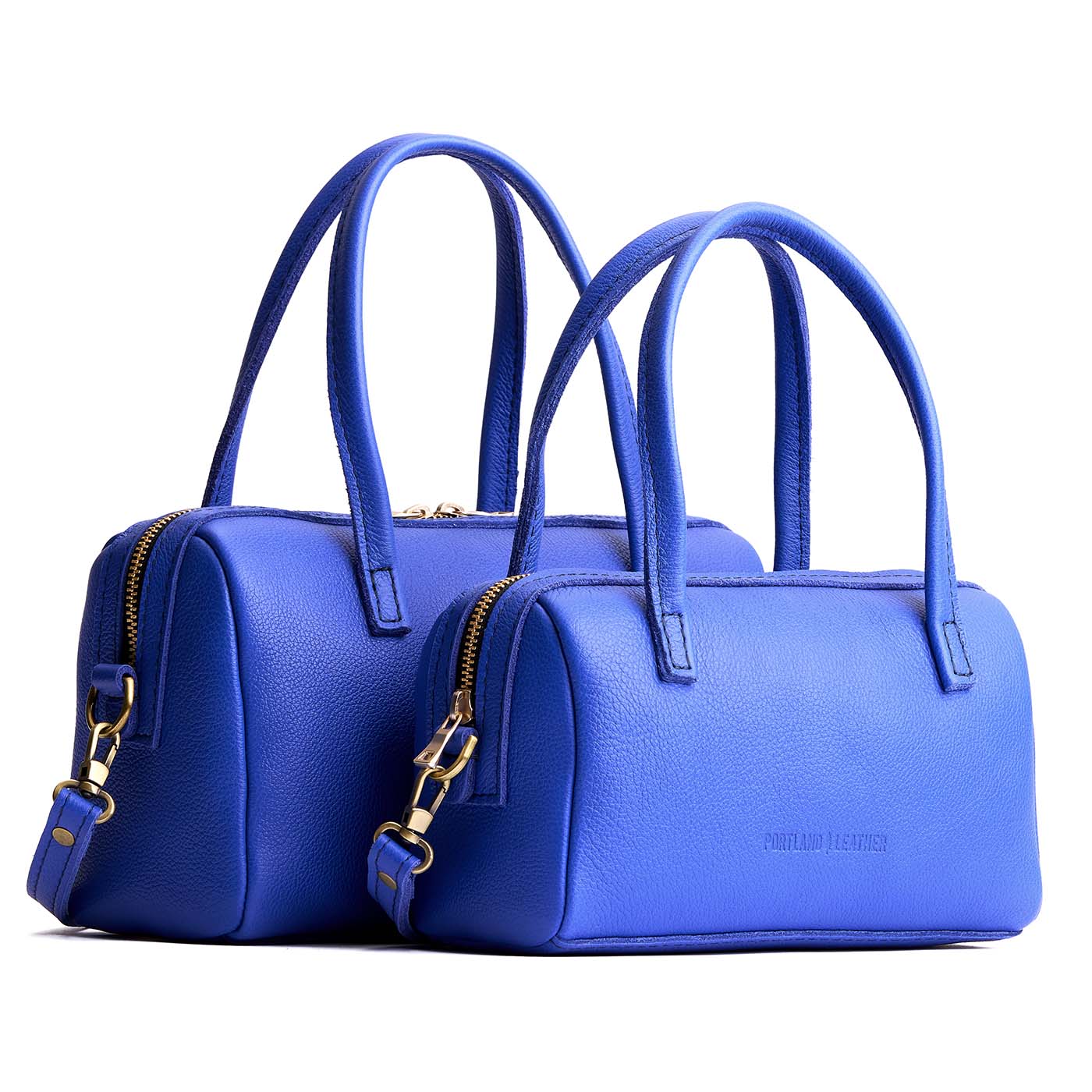 Astro Blue | Two sizes of mini duffle shaped handbag with crossbody strap