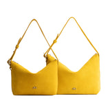 Hello Yellow | Size comparison shot of small and large slouchy leather shoulder bags with zipper opening and three metal tree emblems