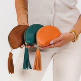 All Variants | Model holding three taco tassel pouches