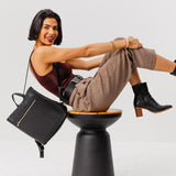 All Color: Black Classic | Model wearing square slim leather tote backpack