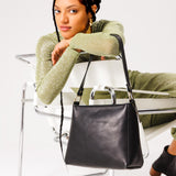  Black | Triangular shoulder bag with antiqued brass finished hardware