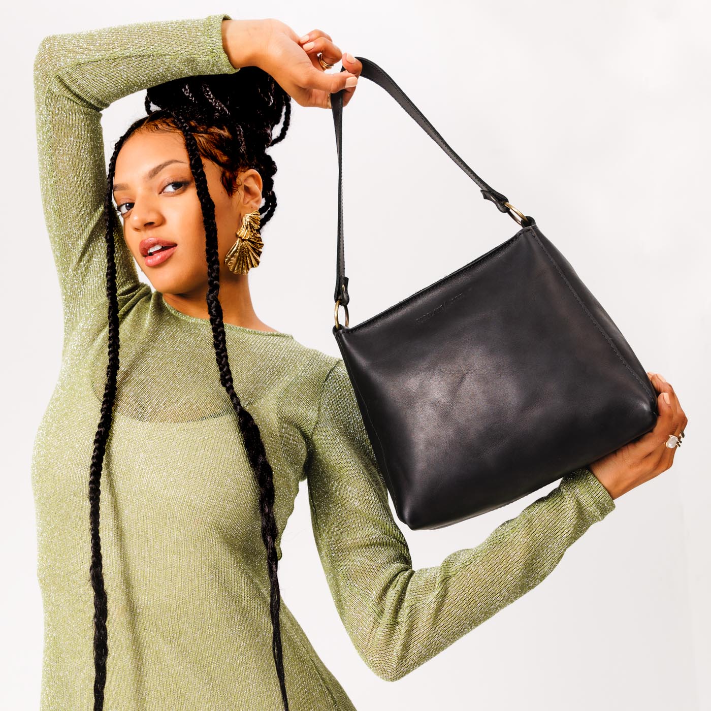  Black | Triangular shoulder bag with antiqued brass finished hardware