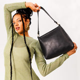  Black | Triangular shoulder bag with antiqued brass finished hardware