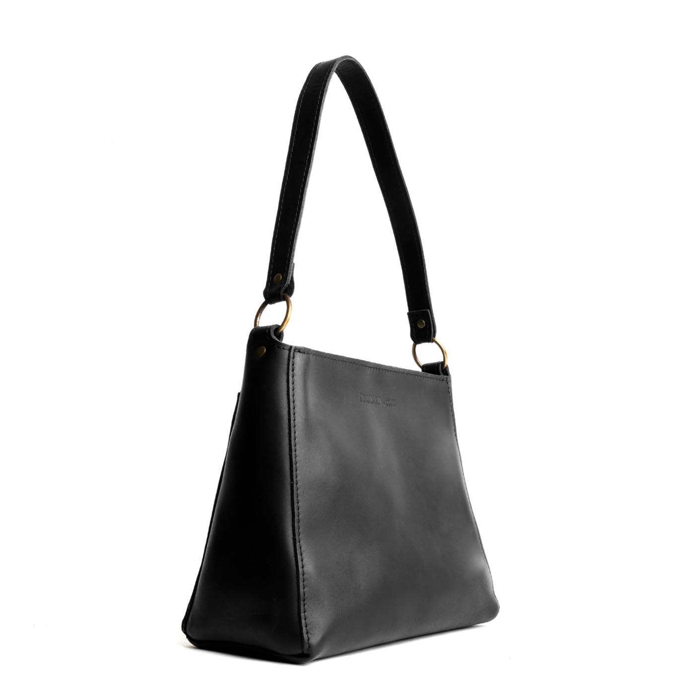 Black | Triangular shoulder bag with antiqued brass finished hardware
