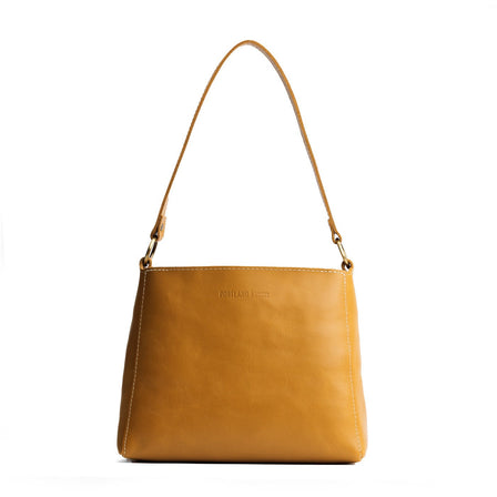 Mango | Triangular shoulder bag with antiqued brass finished hardware