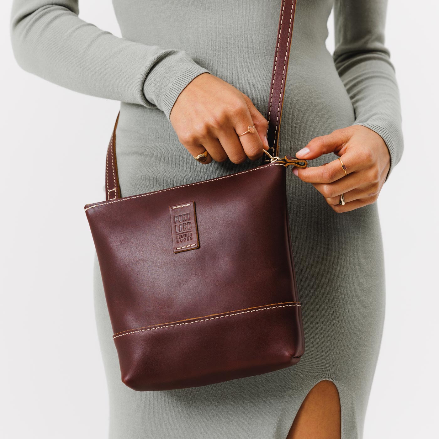  Cognac  | Small rectangular crossbody purse with top zipper and interior pocket