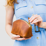 All Color: Honey | Spacious leather makeup bag with curved seams and top zipper