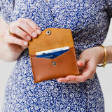 Honey | Model holding small leather envelope card wallet open